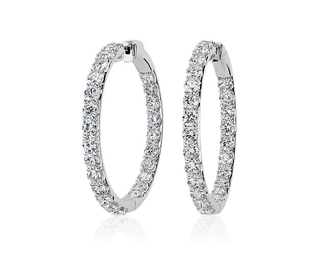 Embody elegance as you sparkle wearing these eternity hoop earrings featuring stunning lab grown diamonds shimmering along the front-facing edges. The 14k white gold design promises enduring quality and lovely lustre.