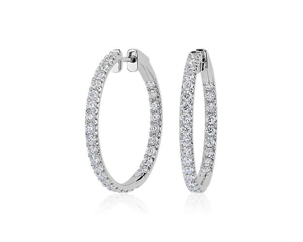Embody elegance when you wear these eternity hoop earrings featuring brilliantly shimmering French pavé-set diamonds adding sparkle along the front-facing edges. The 14k white gold design completes the look with luxurious, lasting quality.