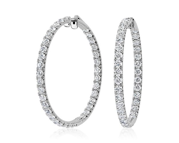 Shimmer through the day in these classic eternithy hoop earrings featuring lustrous 14k white gold design. Delicate diamonds in French pavé settings shimmer along the leading edges, adding dramatic brilliance.