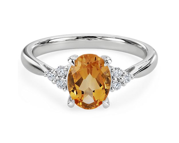 Go for beautifully sparkling statement style when you wear this ring featuring an oval-cut citrine stone at its heart. Accent diamonds sparkle along either side, and the 14k white gold design promises a cool, luxurious lustre.