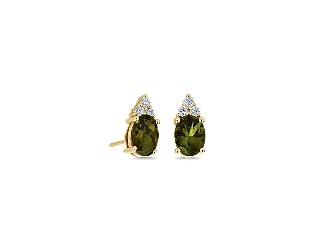 Lend eye-catching shimmer to your style when you wear these stud earrings, set with oval-cut green tourmaline stones, surrounded by a cluster of diamonds for dramatic sparkle. The 14k white gold design promises luxurious quality that lasts.
