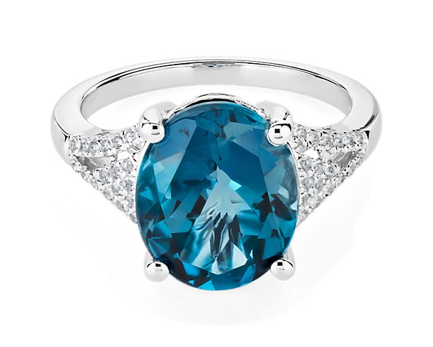Channel timeless elegance when you wear this eye-catching cocktail ring set with a stunning oval-cut London blue topaz stone. It is crafted in luxurious 14k white gold to complement the stone with a cool gleam.