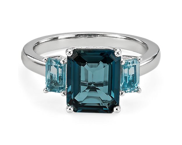 Capture their attention when you wear this statement ring featuring a gorgeous London blue topaz at its center, accented on either side by a sky blue topaz stone. The bright lustre of the 14k white gold design gives it a luxurious finish.