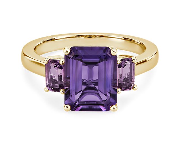 A mesmerizing amethyst sits at the centre of this gorgeous ring, flanked by pink amethysts on either side for a beautiful effect. It is crafted in 14k yellow gold, which promises a warm, timelessly luxurious gleam.