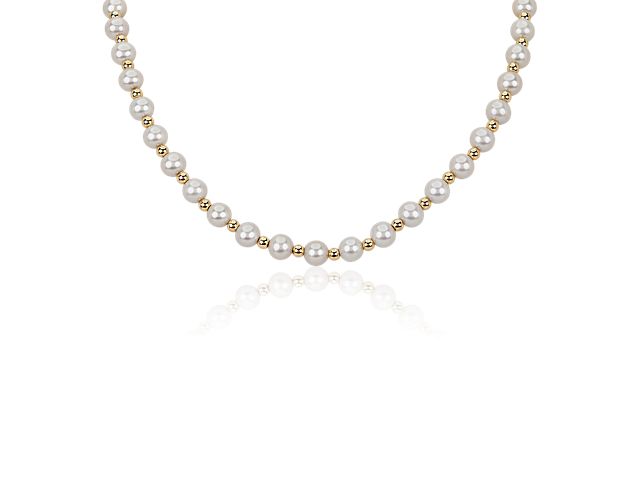This timelessly sophisticated necklace features freshwater beads spaced evenly along its 18'' length. The warm gleam of the 14k yellow gold completes the elegantly luxurious effect.