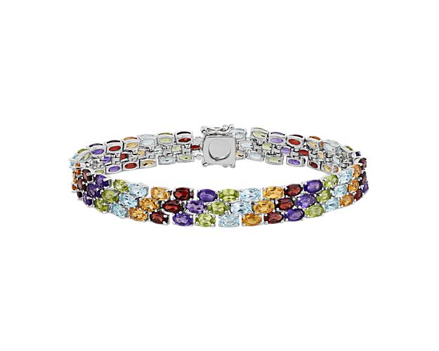 Show your true color with this multi-stone bracelet crafted in sterling silver featuring more than 90 oval gemstones in a flexible triple line design.