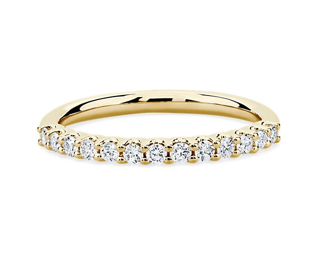A classic beauty, this gorgeous 14k yellow gold diamond ring showcases a sparkling row of shared-prong set diamonds.