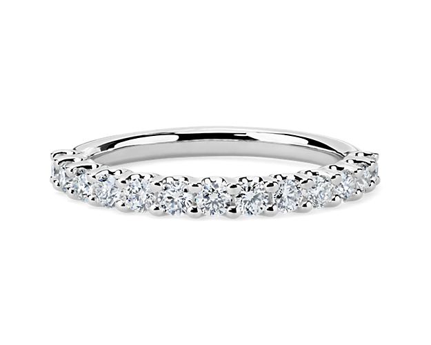 A classic beauty, this gorgeous 14k white gold diamond ring showcases a sparkling row of shared-prong set diamonds.