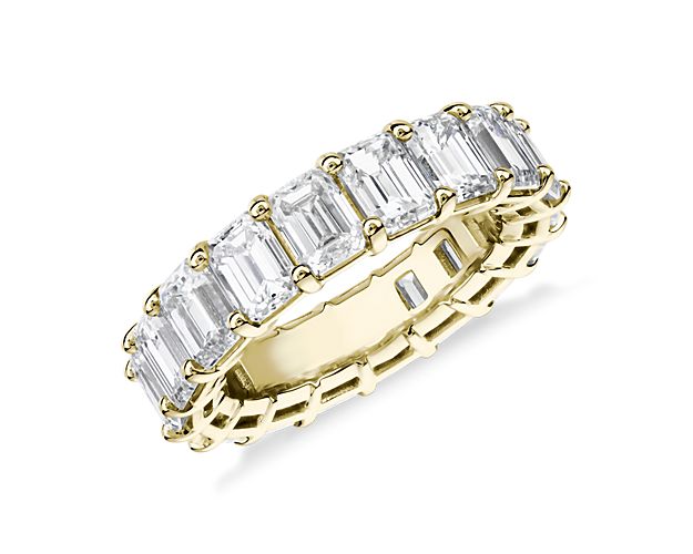 This lab grown diamond emerald-cut eternity ring celebrates the brilliance of love, surrounded by the timeless shine of 14k yellow gold.
