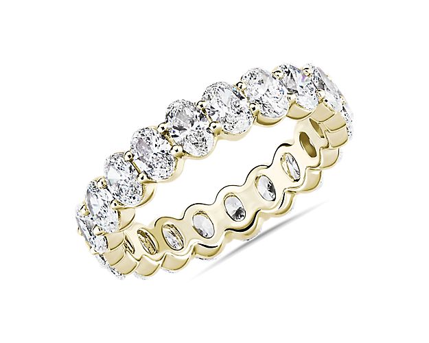 This lab grown diamond oval-cut eternity ring celebrates the brilliance of love, surrounded by the timeless shine of 14k yellow gold.