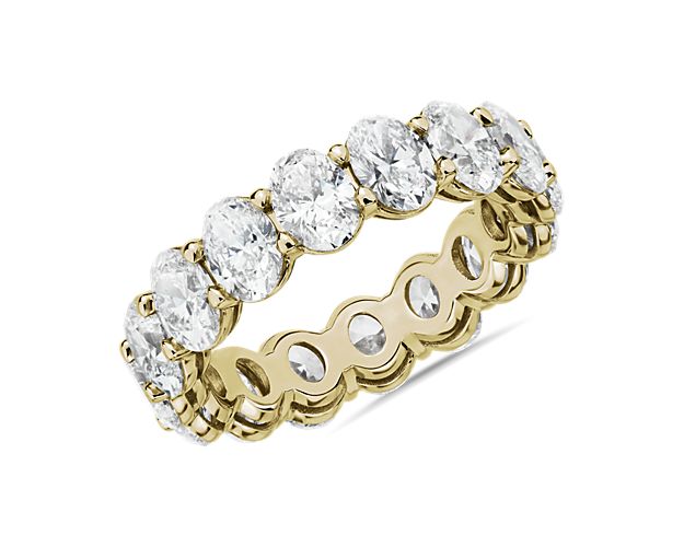 This lab grown diamond oval-cut eternity ring celebrates the brilliance of love, surrounded by the timeless shine of 14k yellow gold.