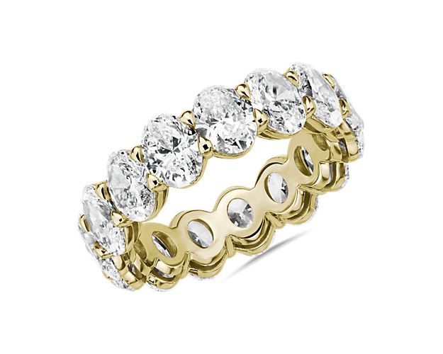 This lab grown diamond oval-cut eternity ring celebrates the brilliance of love, surrounded by the timeless shine of 14k yellow gold.