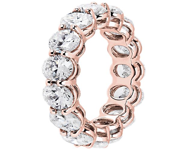 Oval-shaped lab diamond eternity band in rose gold. 