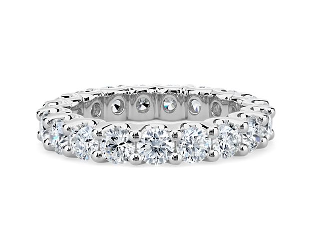 Beautiful as it is bold, this diamond eternity ring is crafted from platinum and showcases breathtaking diamonds in a shared-prong setting.