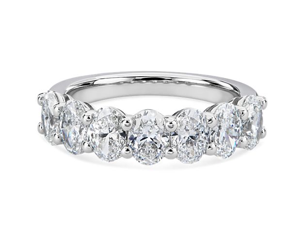 Classic and brilliant, this beautiful diamond band features seven brilliant oval-cut diamonds set in enduring platinum.