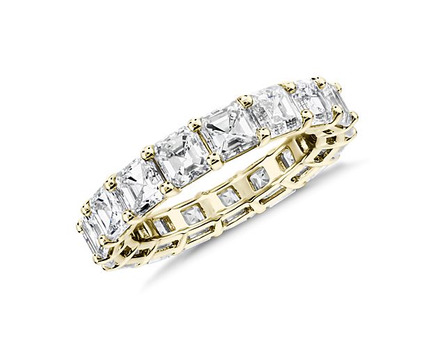 This lab grown diamond asscher-cut eternity ring celebrates the brilliance of love, surrounded by the timeless shine of 14k yellow gold.
