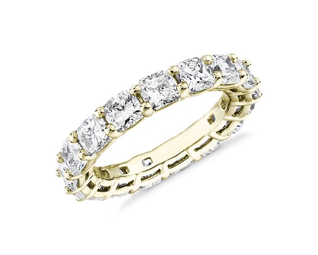 This lab grown diamond cushion-cut eternity ring celebrates the brilliance of love, surrounded by the timeless shine of 14k yellow gold.