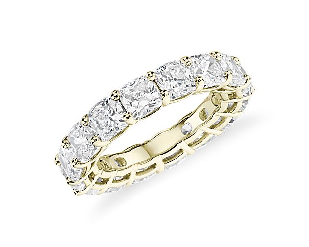 This lab grown diamond cushion-cut eternity ring celebrates the brilliance of love, surrounded by the timeless shine of 14k yellow gold.