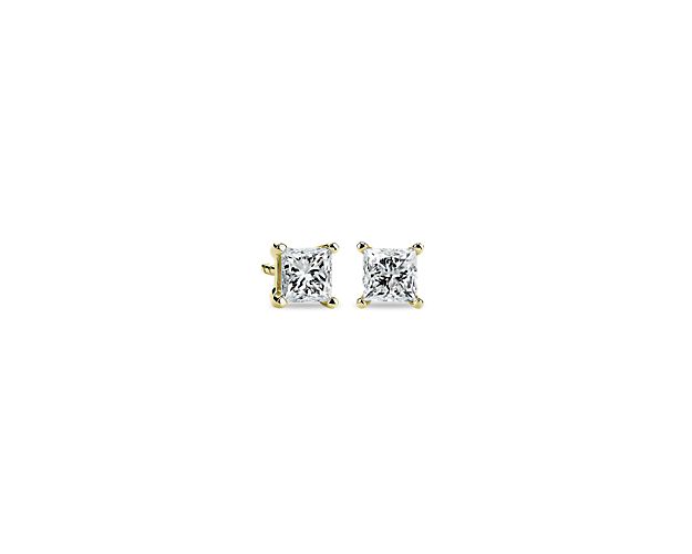 Beautifully matched, these diamond stud earrings feature a pair of princess cut, near-colorless lab grown princess cut diamonds set in 14k yellow gold four-prong settings with double-notched friction backs.