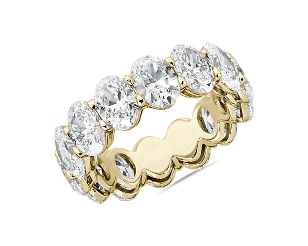 Express never-ending love with this romantic eternity ring featuring 8 ct. tw. of stunning oval-cut diamonds arrange in a low-profile 14k yellow gold setting that promises lasting lustrous beauty.