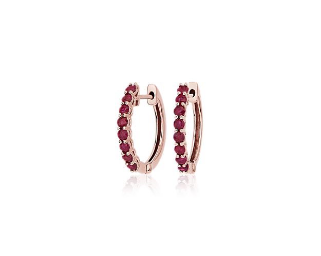 Go ahead, give your earring stack a pop of personality with these 14k rose gold hoop earrings fronted by eight vibrant rubies cut into delicate round shapes.
