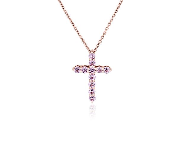 Let your faith shine when you wear this beautiful cross pendant featuring petite pink sapphire shimmering along its arms. The warm gleam of the 14k rose gold design perfectly complements the color of the stones.