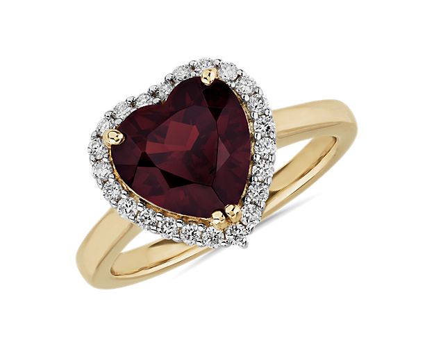 Heart-shaped garnet ring with halo diamonds in yellow gold