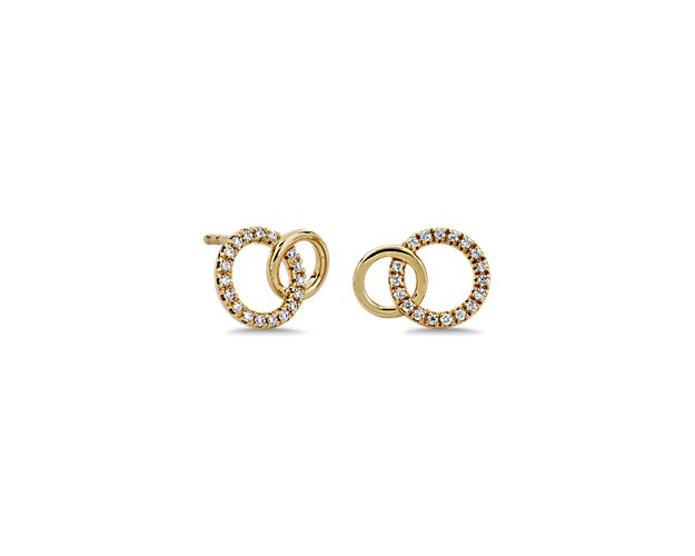 Add a touch of sparkle to your style with these elegant earrings featuring a diamond-detailed circle interlined with a sleek plain circle. The warm lustre of the 14k yellow gold gives them timeless elegance and quality.