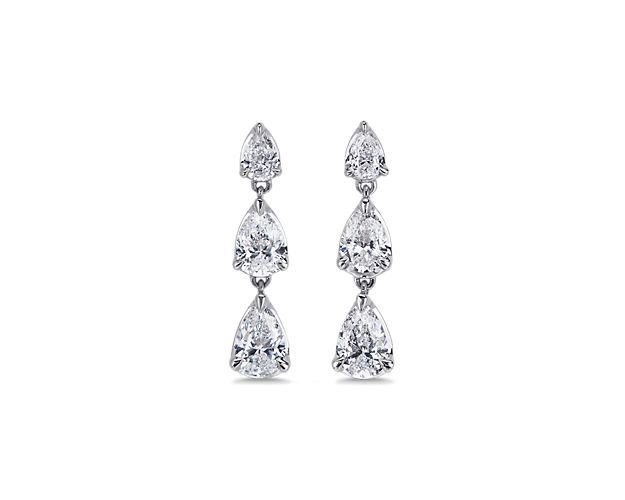 A gorgeous trio of pear-cut diamonds dangle from each of these drop earrings, lending luxurious sparkle to your ensemble. They feature coolly gleaming 14k white gold design, and can be paired with the matching pendant for a coordinated look.