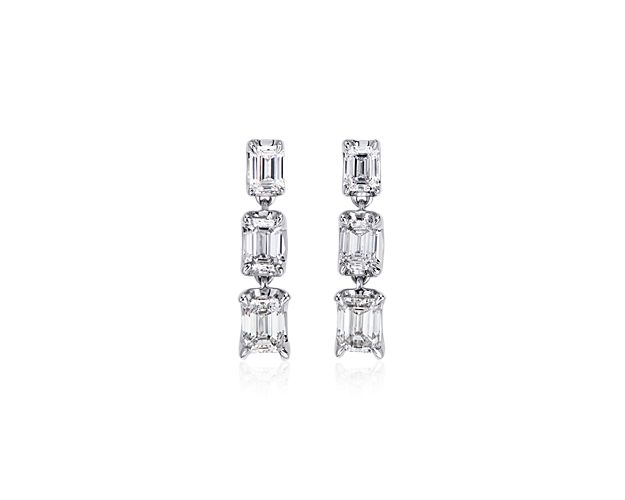 Accent your look with stunning sparkle when you wear these gorgeous drop earrings, each featuring a trio of emerald-cut diamonds in graduating sizes. Designed in 14k white gold, they promise timelessly elegant luxury.
