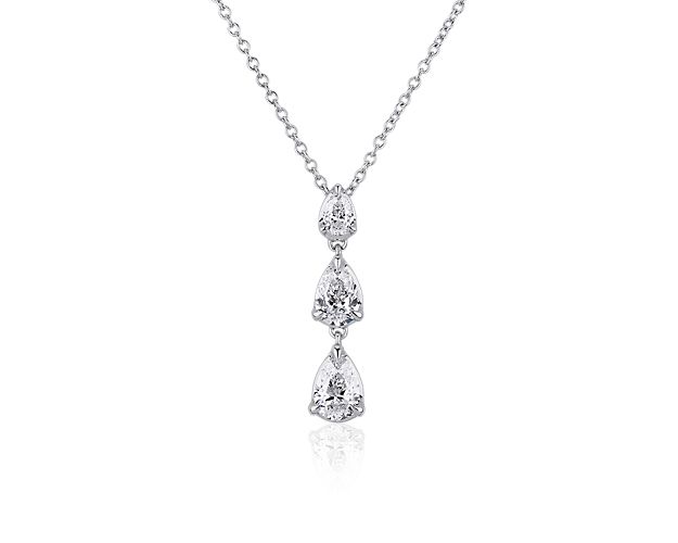 A shimmering trio of pear-cut diamonds in graduating sizes gracefully drape, forming an elegant pendant in this stunning necklace. It features 14k white gold design that complements the stones with a cool gleam. Pair it with the matching earrings to complete the look.