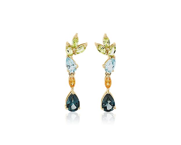 Elevate your style with these unique drop earrings, featuring a gorgeous array of dangling peridot, citrine and blue topaz stones in an array of stunning cuts. The setting of gleaming 14k yellow gold adds a luxurious finish.