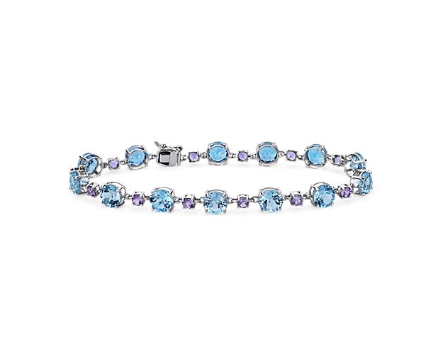 Lend elegant sparkle to your wrist with this stunning bracelet featuring round-cut sky blue topaz stones and pink amethyst stones in different sizes alternating along its length. The 14k white gold design delivers lasting quality and beauty.