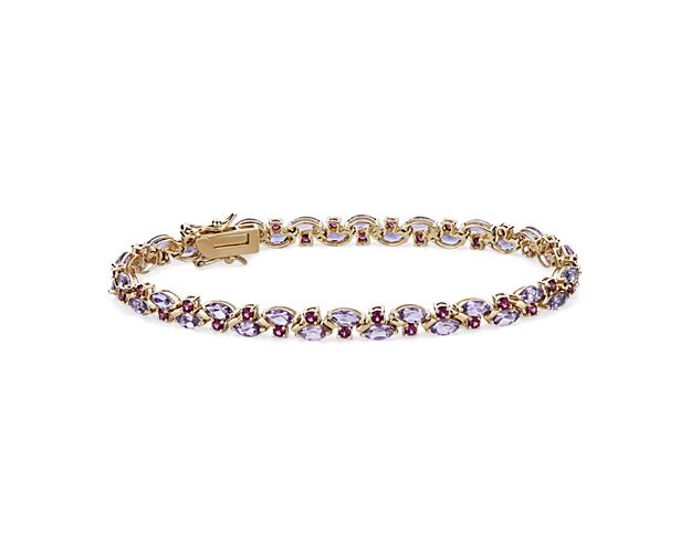 Eye-catching and unique, this bracelet features gorgeous marquise-cut pink amethyst and round-cut rhodolite stones alternating in a graceful design. It features warmly lustrous 14k yellow gold design to complement the stones.