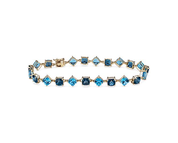 This elegant bracelet features brilliant cushion-cut London blue topaz and Swiss blue topaz stones spaced along its length in eye-catching alternating orientations. It is crafted in luxurious 14k yellow gold for a beautiful look that delivers lasting quality.