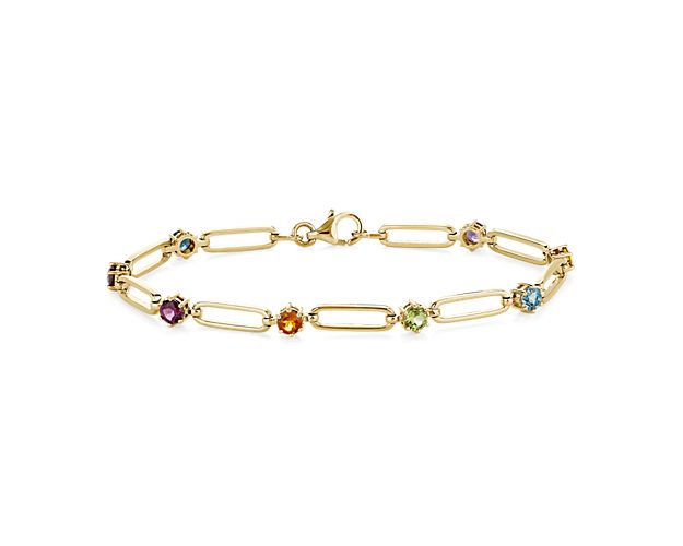 Elegantly unique, this bracelet features a paperclip design in lustrous 14k yellow gold. Between each link shimmers a delicate round-cut gemstone in an array of beautiful hues.
