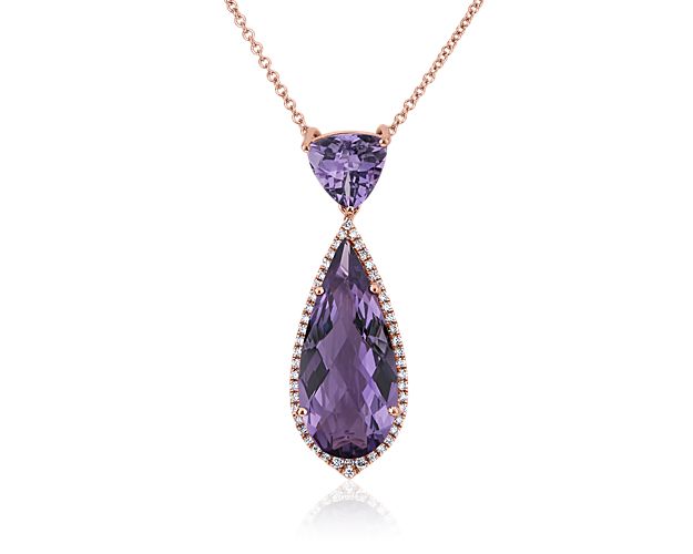 Catch the eye with this gorgeous drop pendant featuring a trillion-cut and pear-cut amethyst dangling gracefully. A diamond halo lends dramatic sparkle to the lower stone, and the rose gold setting adds warm romance to the look.