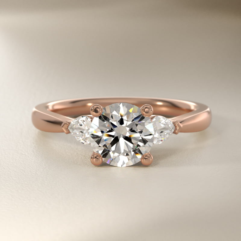 Pear Sidestone Lab-Grown Diamond Engagement Ring in 14k Rose Gold (1/4 ct. tw.)