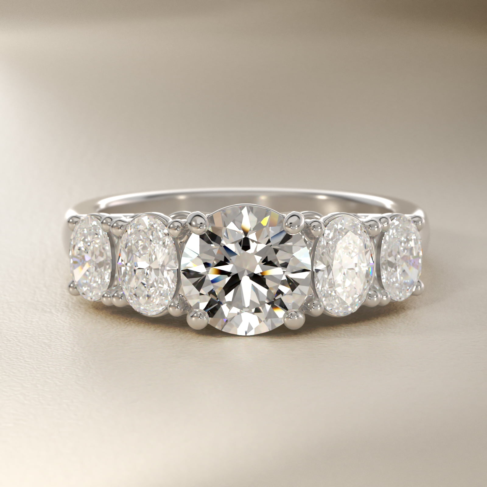 Graduated Oval Diamond Engagement Ring in 18k White Gold (1/2 ct. tw.)