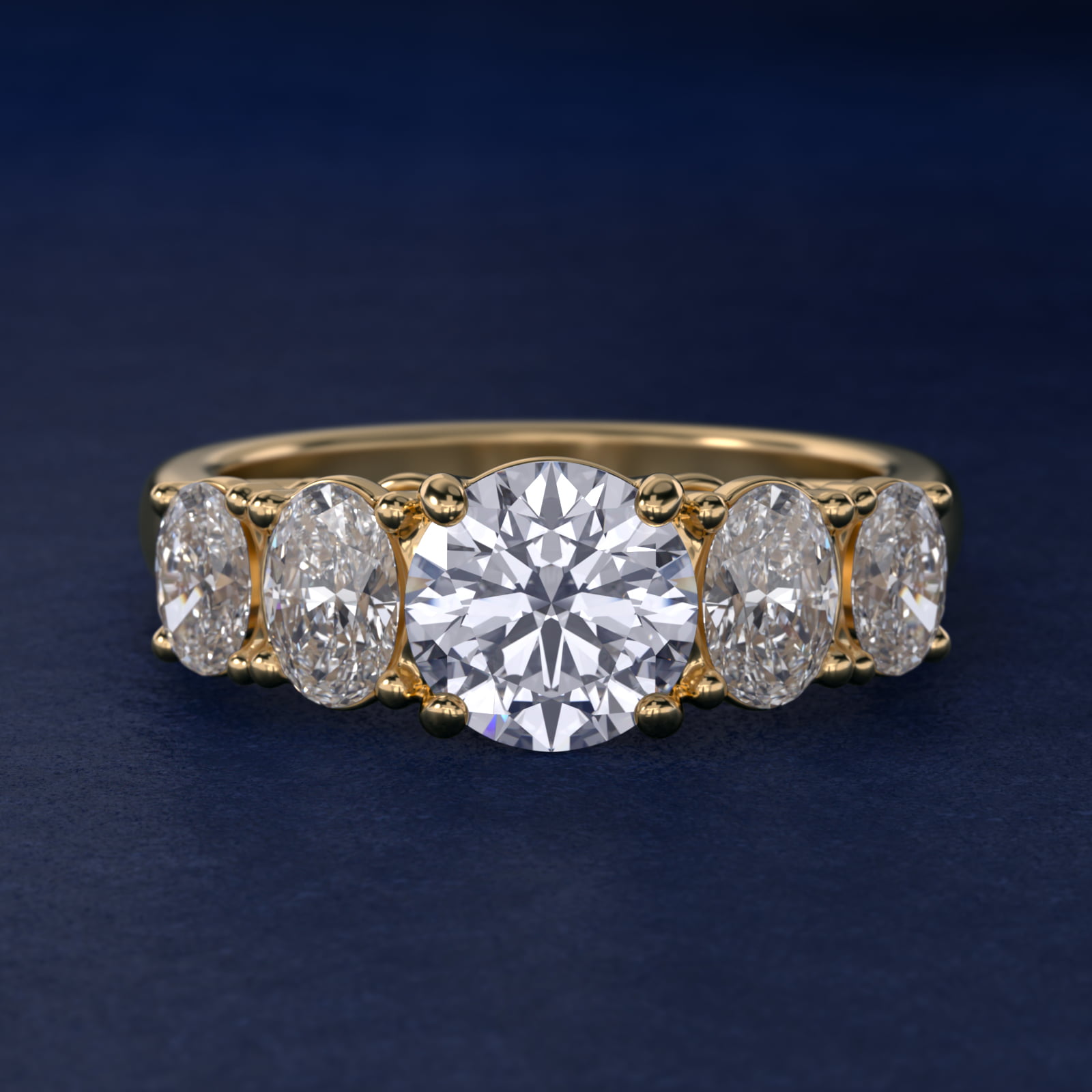 Graduated Oval Diamond Engagement Ring in 14K Yellow Gold (1/2 ct. tw.)