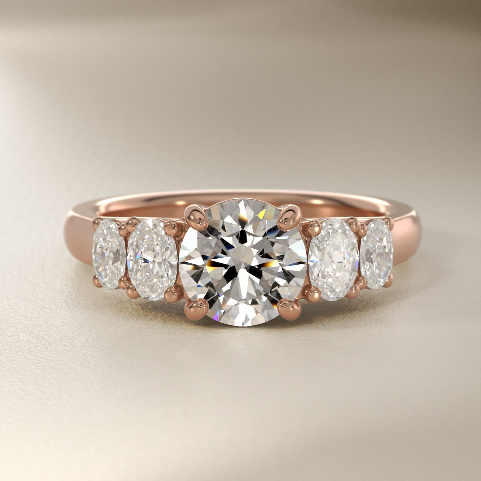 Graduated Oval Diamond Engagement Ring in 18k Rose Gold (7/8 ct. tw.)