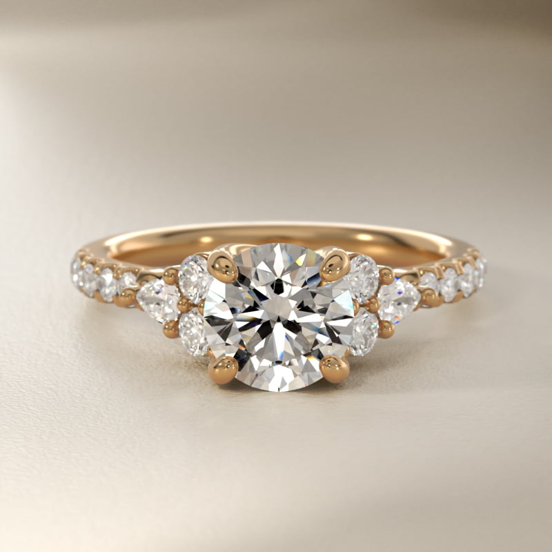 Romantic Round and Pear Cluster Diamond Engagement Ring in 14k Yellow Gold (1/3 ct. tw.)