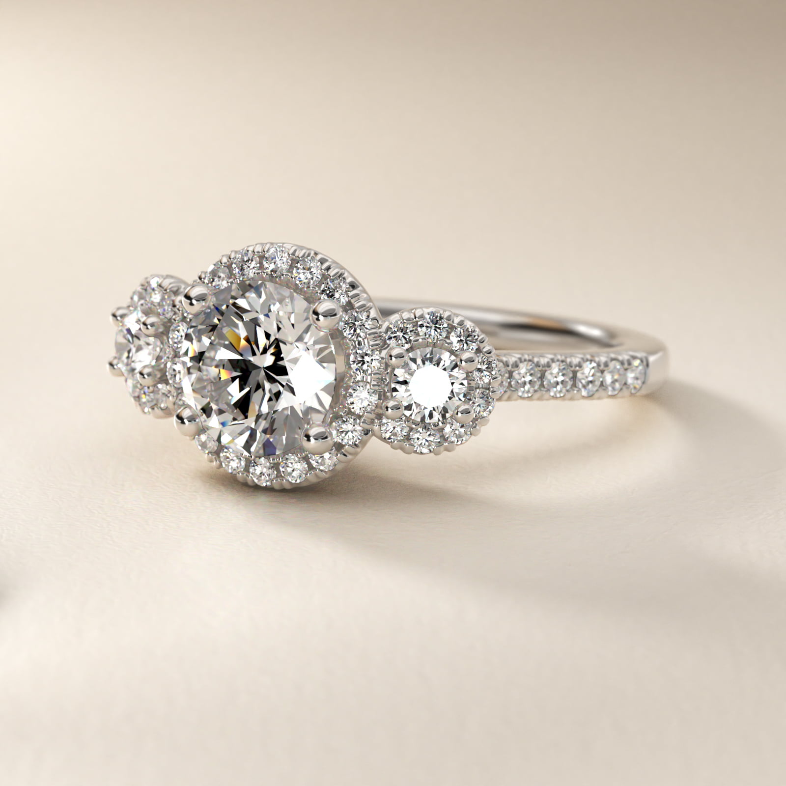 Three-Stone Halo Diamond Engagement Ring in Platinum