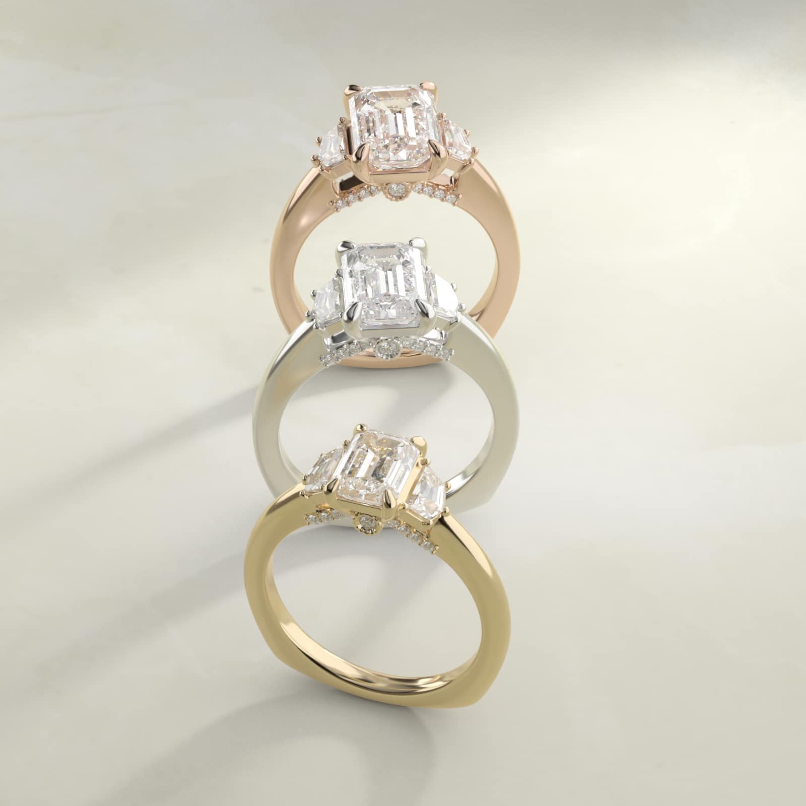 Zac Zac Posen Three-Stone Emerald Cut diamond engagement ring in 14K yellow gold