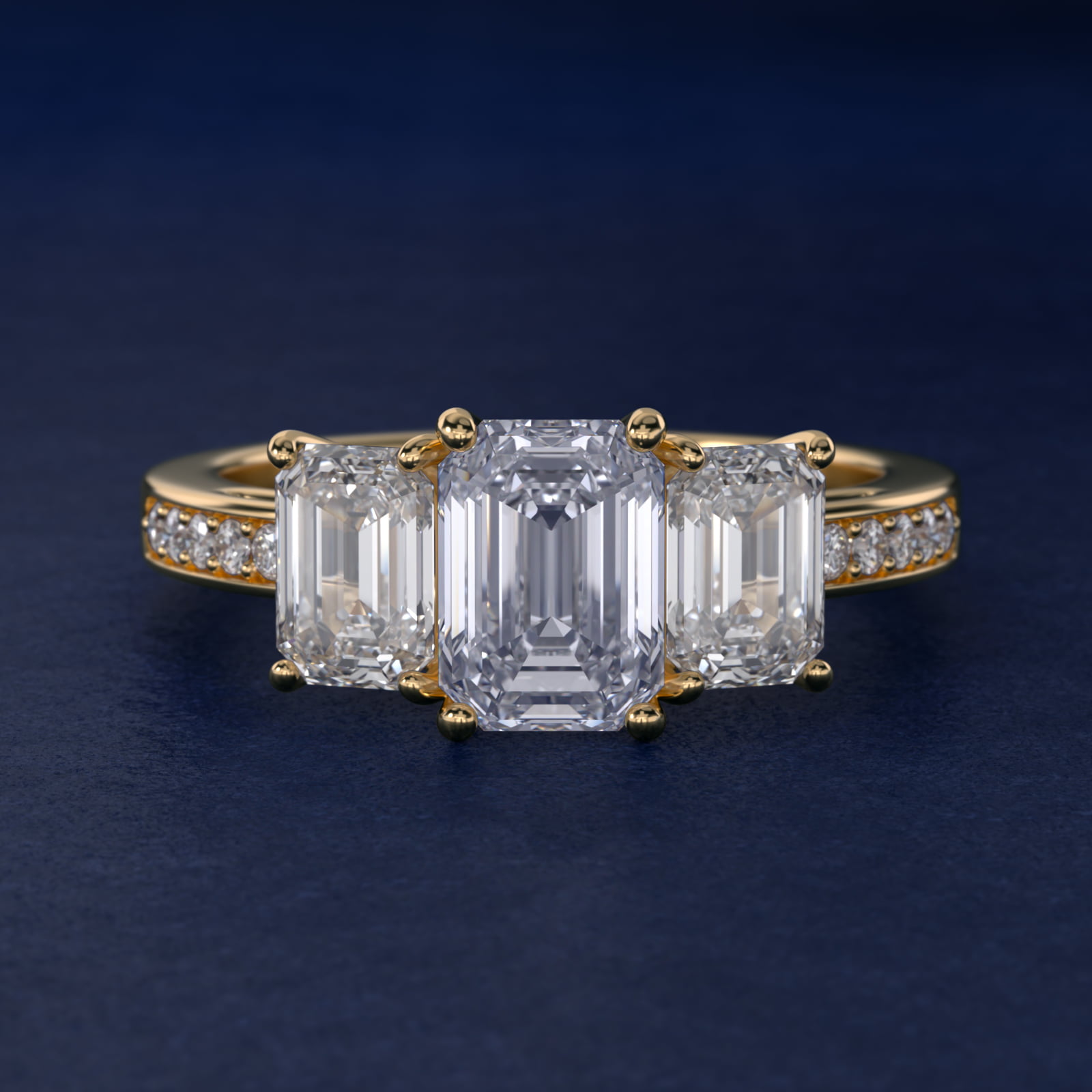 Emerald Cut Diamond Three Stone Engagement Ring With Pavé Set Diamonds In 18K Yellow Gold By James Allen