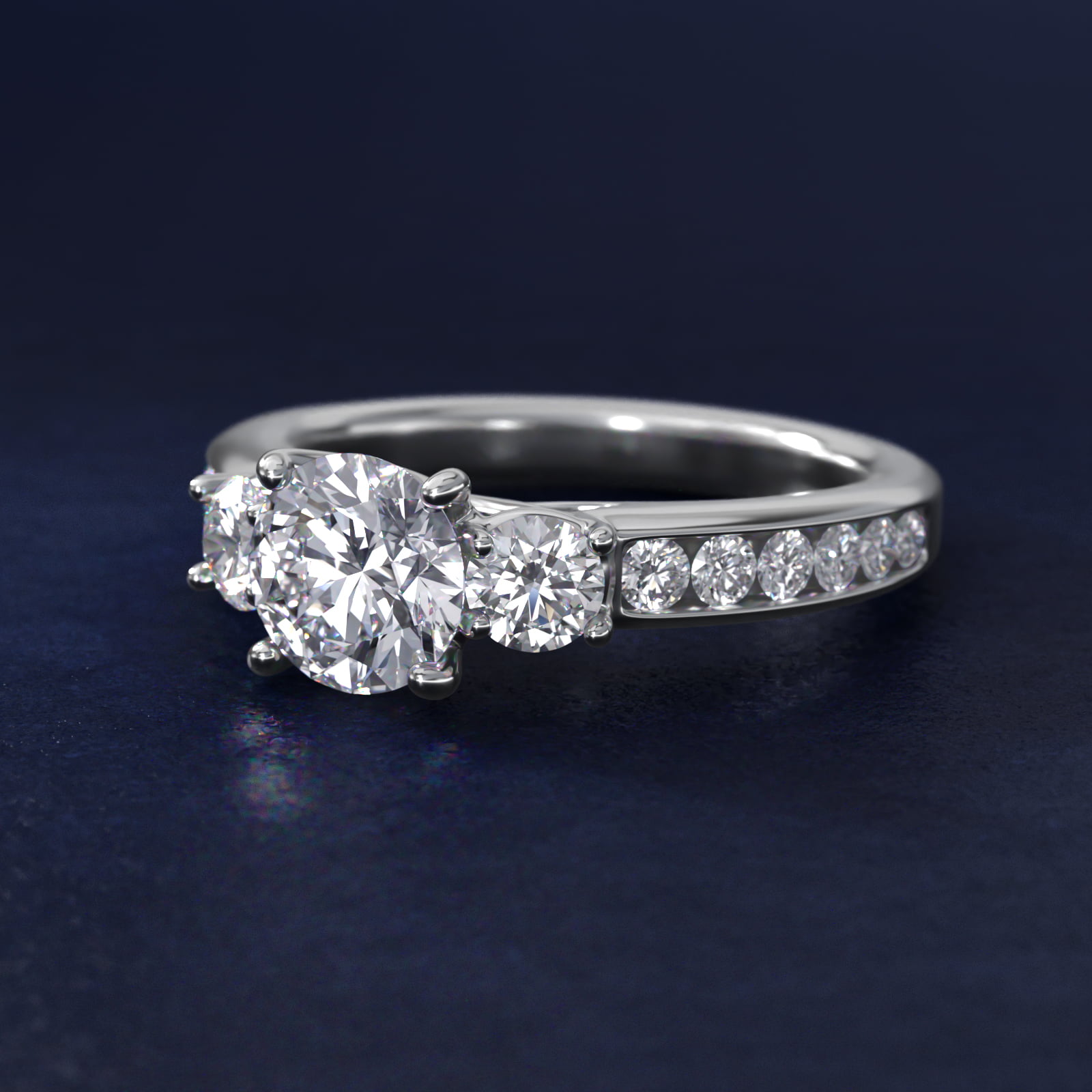 Channel Set Diamond Three Stone Engagement Ring In Platinum