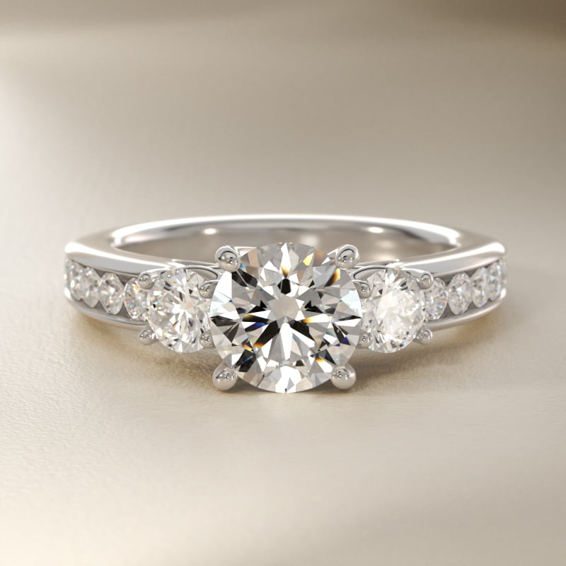 Channel Set Diamond Three Stone Engagement Ring In Platinum