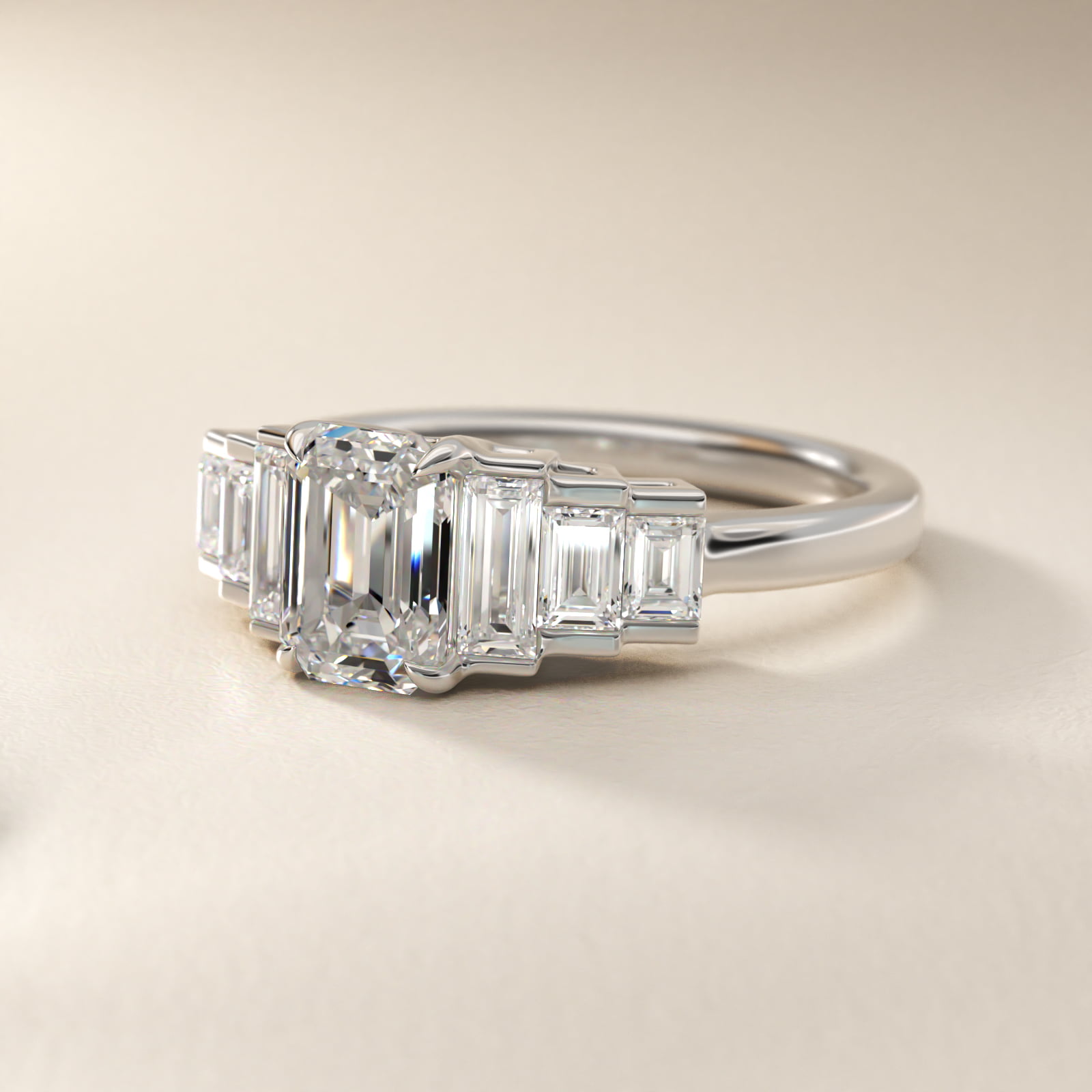 Emerald cut diamond solitaire engagement ring in white gold on white background
