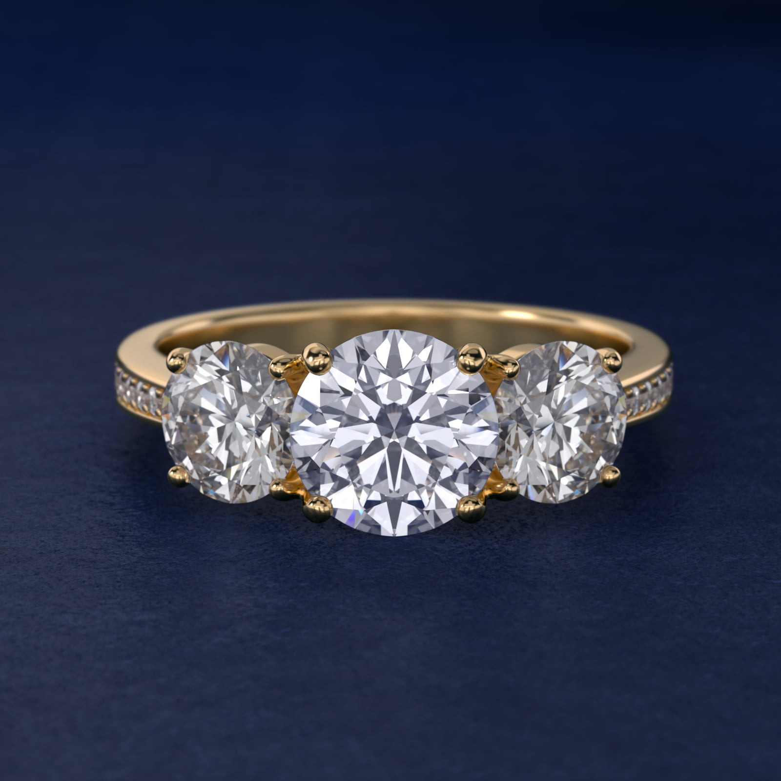 Round Diamond Three Stone Engagement Ring With Pavé Set Diamonds In 18K Yellow Gold By James Allen
