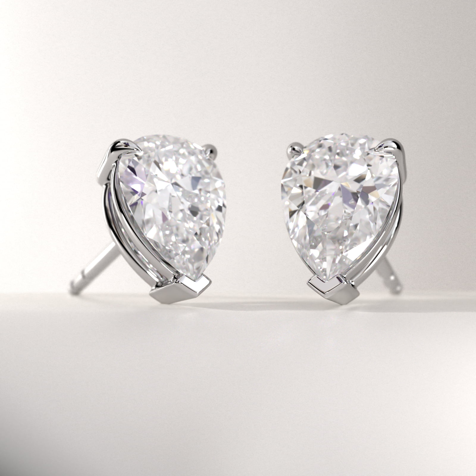 Pear Cut Diamond Stud Earrings In 18K White Gold (Setting)